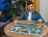 Ravensburger Puzzle 1500pc - A Bustling Fantasy Port